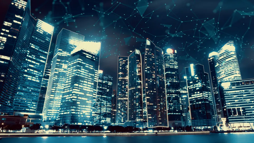 Night city skyline with a network overlay